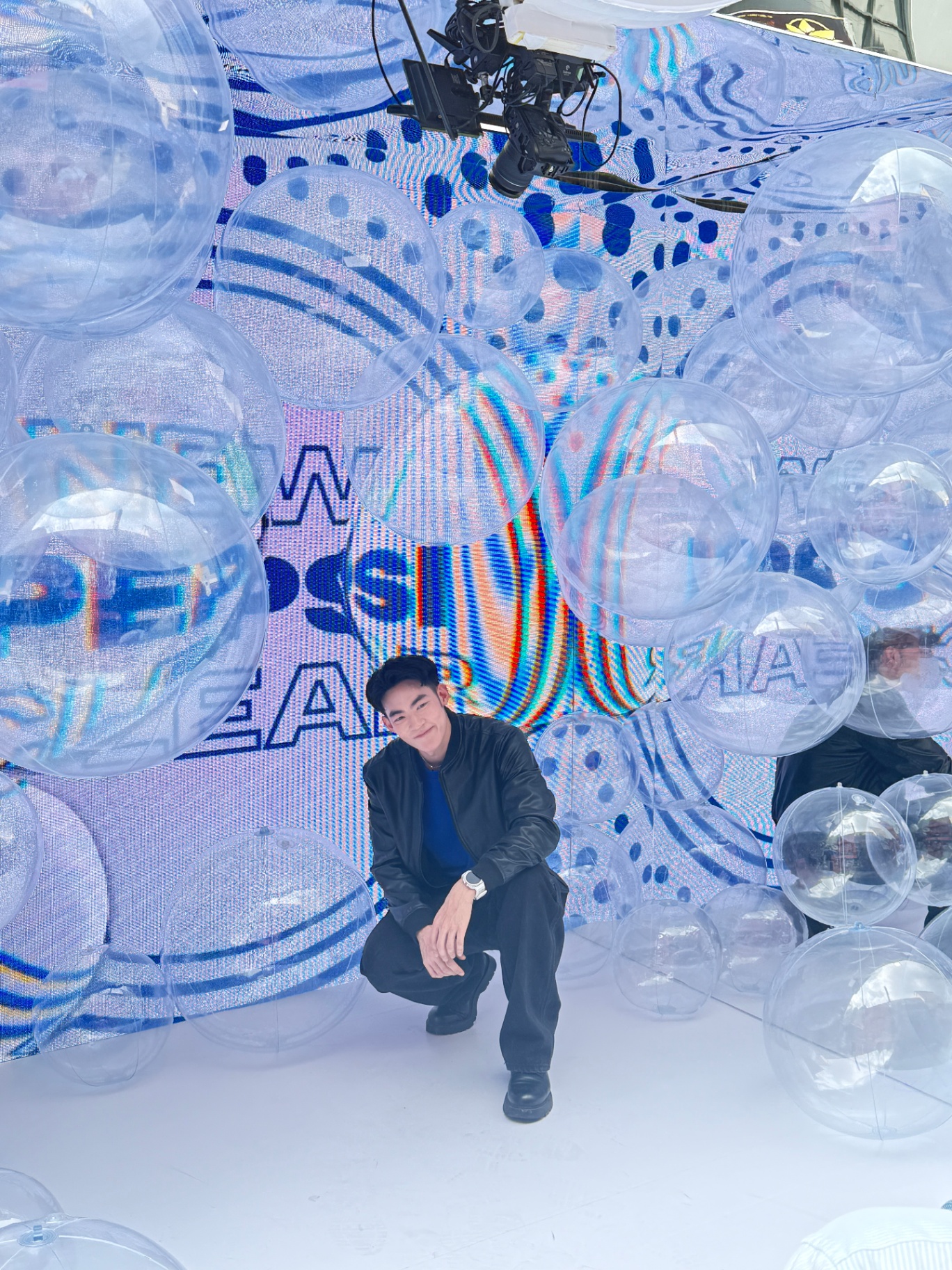 Immersive transparent-bubble installation with LED backdrop — custom photobooth activation